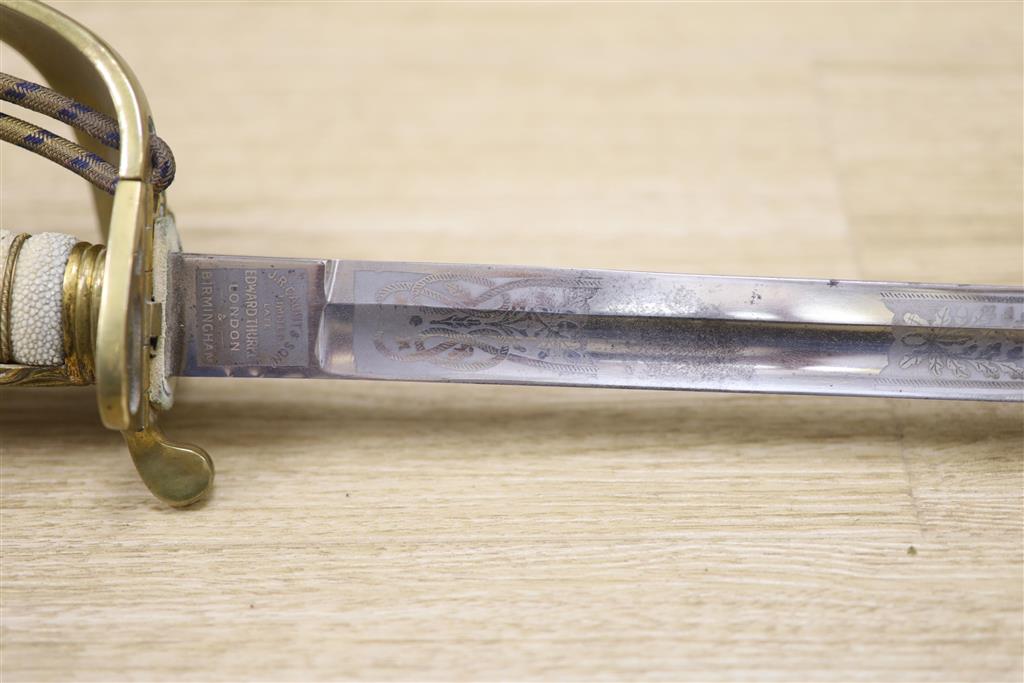 A George V Naval officers sword, by J R Gaunt & Son, Serial No. 16427 together with scabbard and leather case